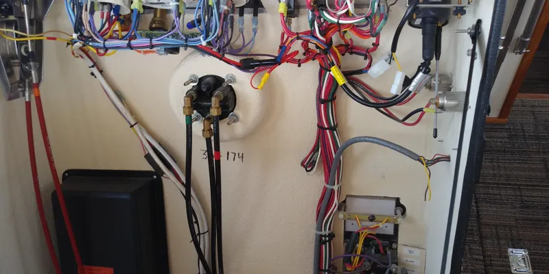 Slide: The Image of View of a 2001 Nordic Tug 32 engine room with wires and connections. - 39