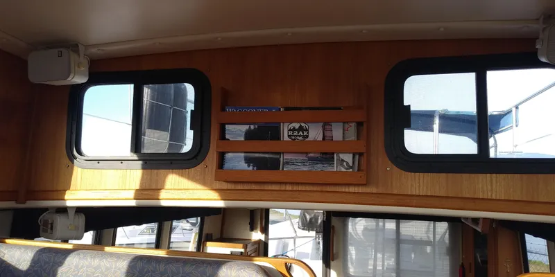 Slide: The Image of Interior of a 2001 Nordic Tug 32 with wooden walls and windows. - 36