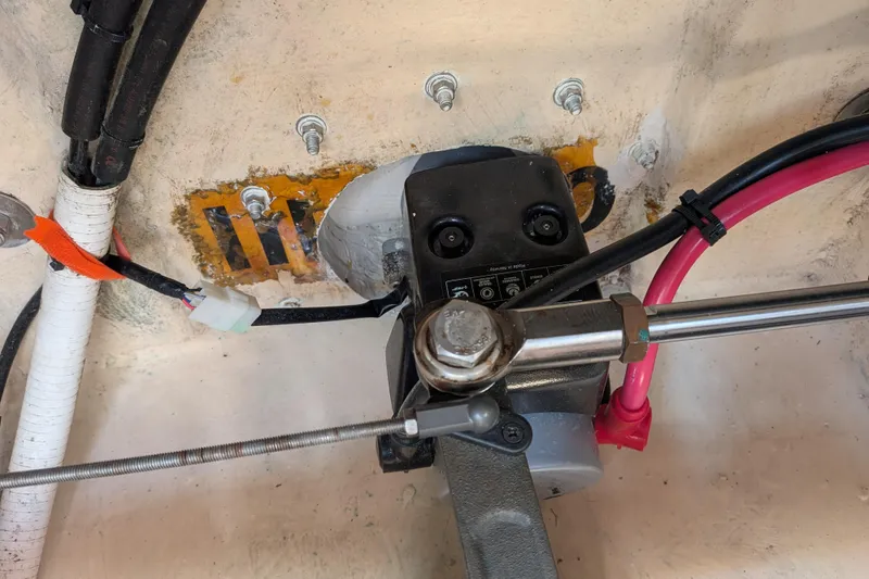Slide: The Image of Engine compartment of a 2001 Nordic Tug 32, showing mechanical components and wiring. - 75