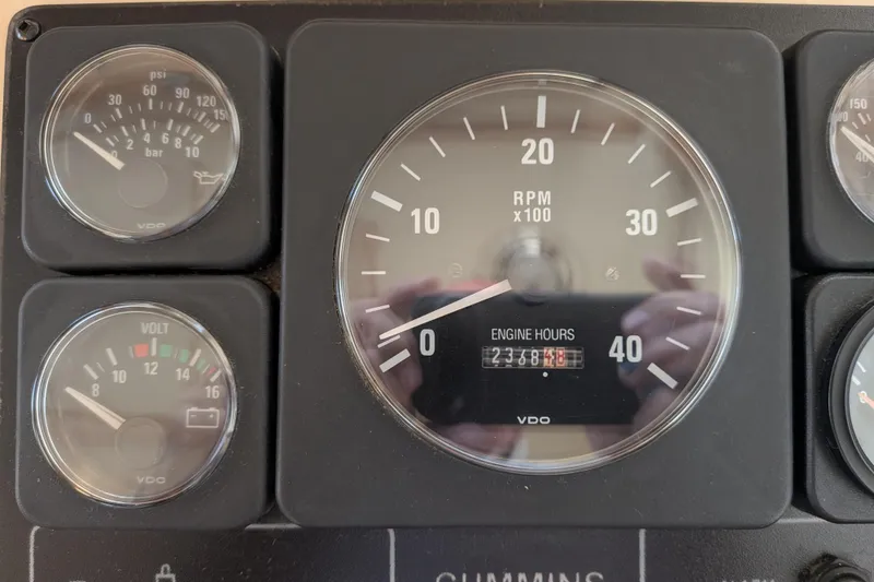 Slide: The Image of Close-up of 2001 Nordic Tug 32 engine gauges displaying RPM, engine hours, and voltage. - 35