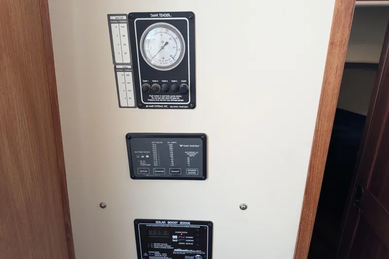 Slide: The Image of Control panel of a 2001 Nordic Tug 32, featuring tank and solar boost gauges. - 42