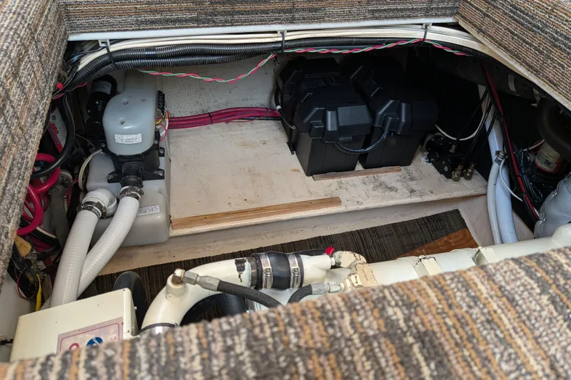 Slide: The Image of Engine compartment of a 2001 Nordic Tug 32, showing mechanical components and wiring. - 63