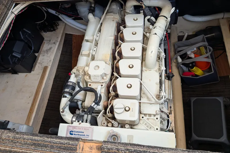 Slide: The Image of Engine compartment of a 2001 Nordic Tug 32, featuring a Cummins diesel engine. - 58
