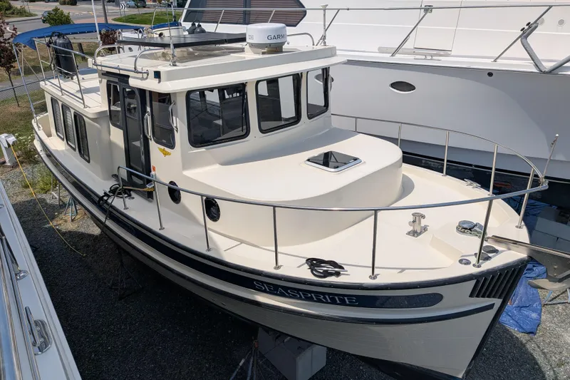 Slide: The Image of 2001 Nordic Tug 32 boat named Seasprite, docked and ready for adventure. - 0