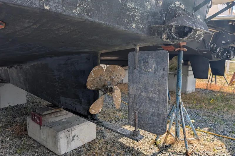 Slide: The Image of 2001 Nordic Tug 32 boat propeller and rudder on dry dock. - 76