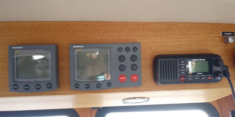 Slide: The Image of Navigation instruments and a radio on a wooden dashboard. - 30