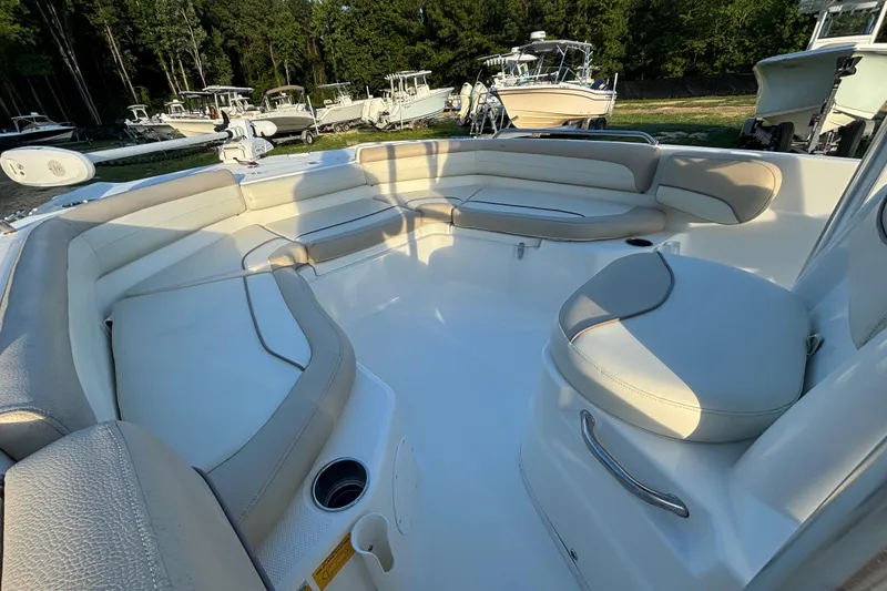 Slide: The Image of 2018 NauticStar 211 Coastal boat interior with spacious seating and cup holders. - 12