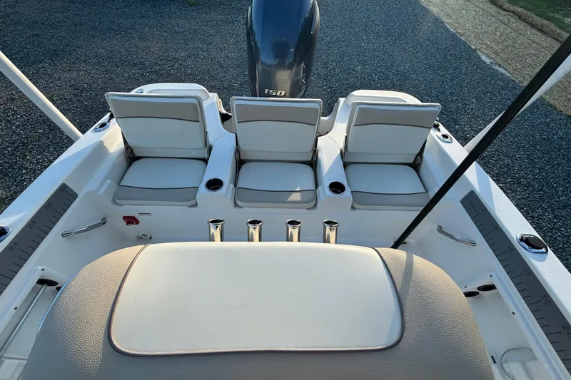 Slide: The Image of 2018 NauticStar 211 Coastal boat interior with seating and engine view. - 9