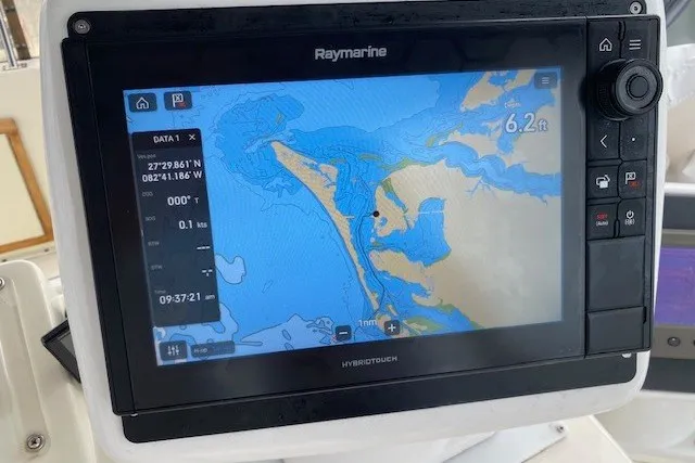 Slide: The Image of Raymarine navigation display on 1984 Hatteras 46 Convertible, showing nautical chart and coordinates. - 28