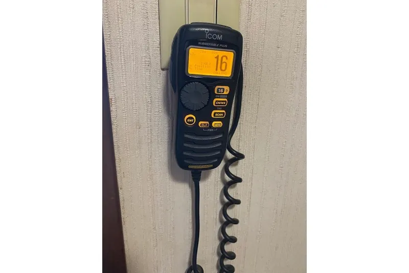 Slide: The Image of Icom marine radio on 1984 Hatteras 46 Convertible yacht, displaying channel 16. - 44