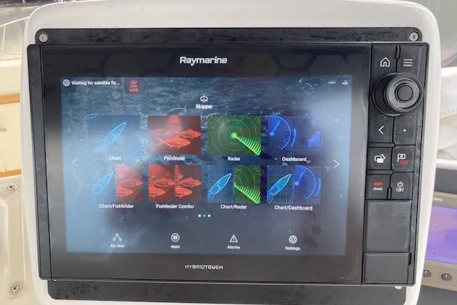 Slide: The Image of Raymarine navigation system on 1984 Hatteras 46 Convertible boat, displaying chart and radar options. - 23