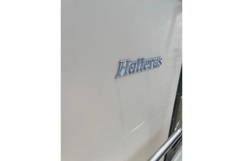 Slide: The Image of Close-up of 1984 Hatteras 46 Convertible yacht logo on white surface. - 15