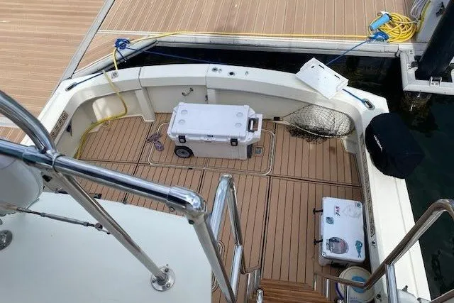 Slide: The Image of 1984 Hatteras 46 Convertible yacht deck with fishing gear and equipment. - 11