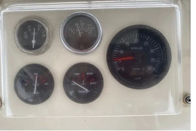 Slide: The Image of Instrument panel of a 1984 Hatteras 46 Convertible boat with gauges. - 22