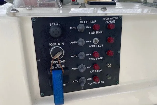 Slide: The Image of Control panel of a 1984 Hatteras 46 Convertible boat with bilge pump switches. - 25