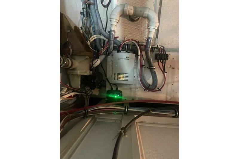 Slide: The Image of Electrical system inside a 1984 Hatteras 46 Convertible boat, featuring wiring and components. - 48