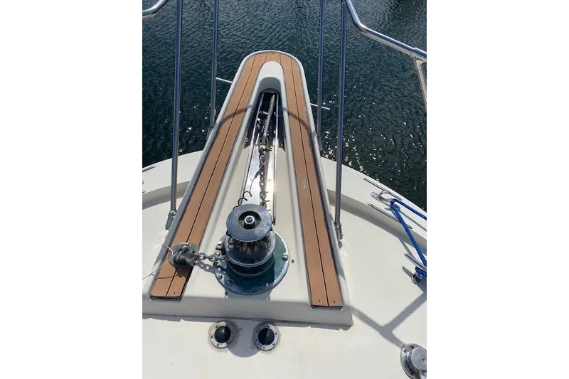 Slide: The Image of Bow of 1984 Hatteras 46 Convertible yacht with anchor chain and winch. - 12