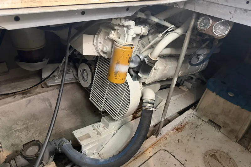 Slide: The Image of Engine compartment of a 1989 Trojan International 12 Meter Motor Yacht, showing mechanical components. - 31