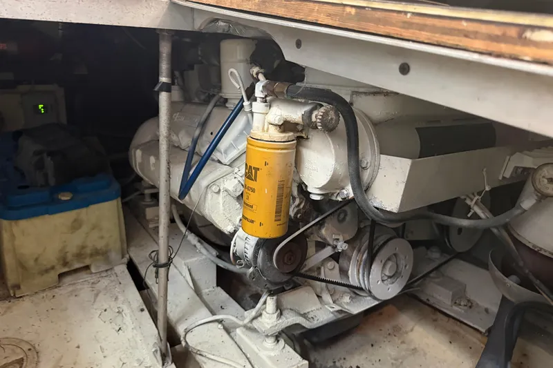 Slide: The Image of Engine compartment of a 1989 Trojan International 12 Meter Motor Yacht, featuring mechanical components. - 32