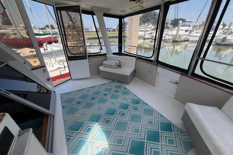 Slide: The Image of Interior of 1989 Trojan International 12 Meter Motor Yacht with marina view. - 14
