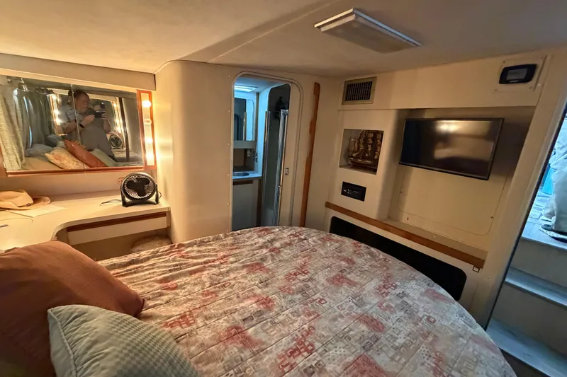 Slide: The Image of Cozy bedroom in 1989 Trojan International 12 Meter Motor Yacht with TV and vanity. - 27