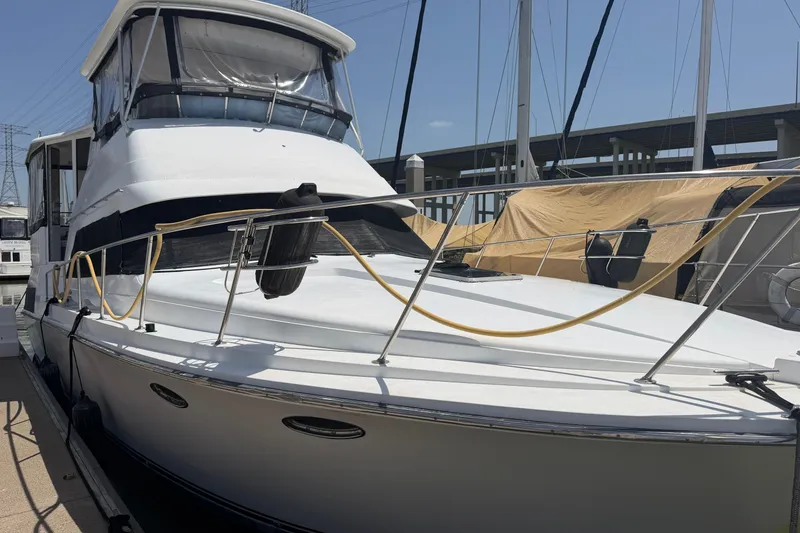 Slide: The Image of 1989 Trojan International 12 Meter Motor Yacht docked at marina. - 3
