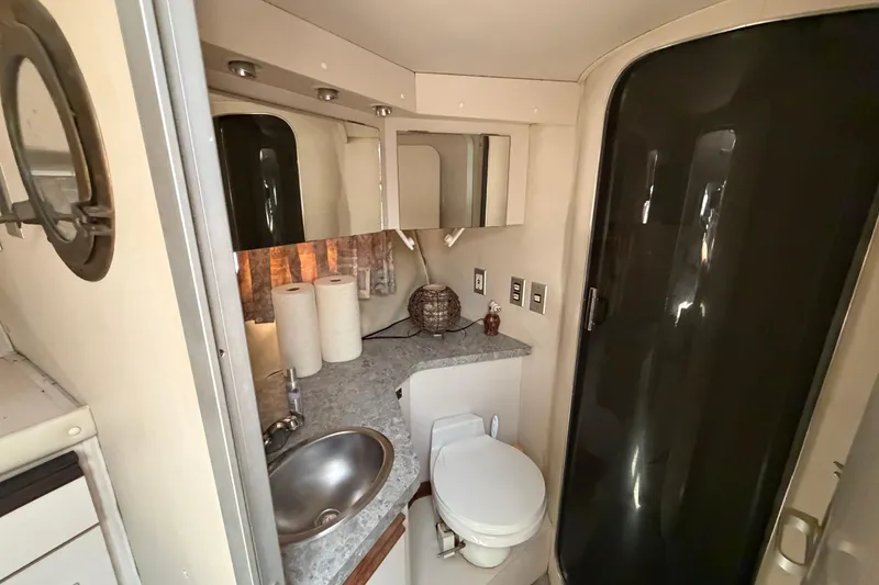 Slide: The Image of Bathroom interior of 1989 Trojan International 12 Meter Motor Yacht with sink and toilet. - 24