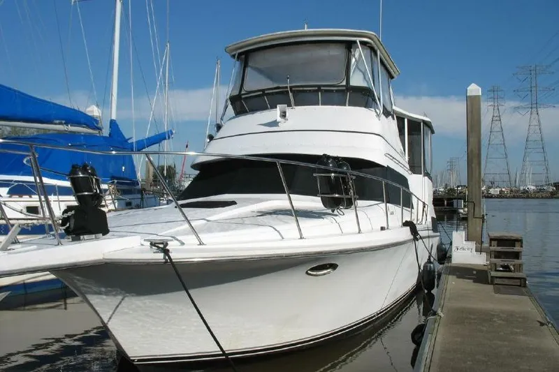 Slide: The Image of 1989 Trojan International 12 Meter Motor Yacht docked at marina. - 5