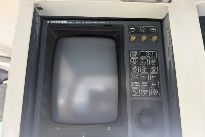 Slide: The Image of Control panel of a 1989 Trojan International 12 Meter Motor Yacht with Furuno display. - 35