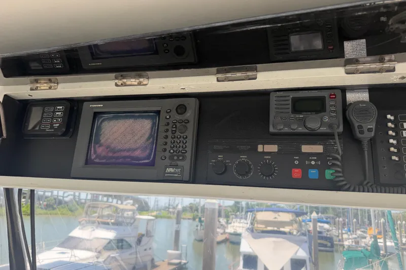 Slide: The Image of Control panel of a 1989 Trojan International 12 Meter Motor Yacht with navigation equipment. - 36