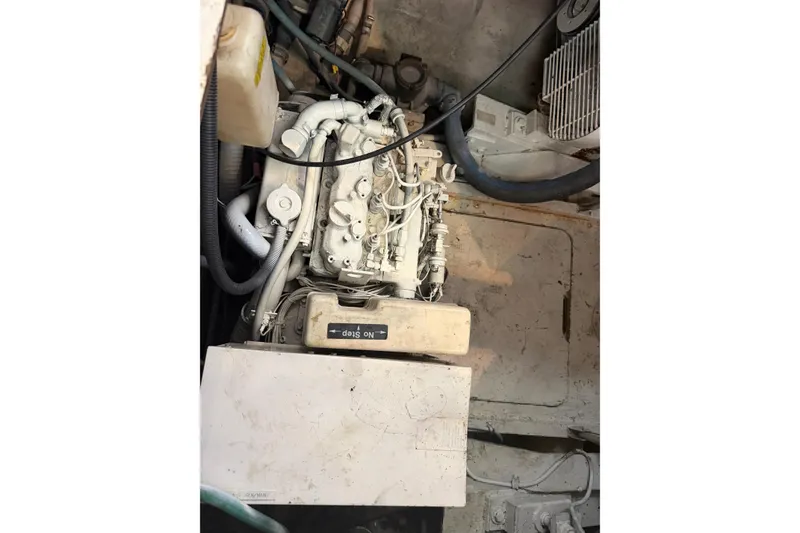 Slide: The Image of Engine compartment of a 1989 Trojan International 12 Meter Motor Yacht, showing mechanical components. - 30