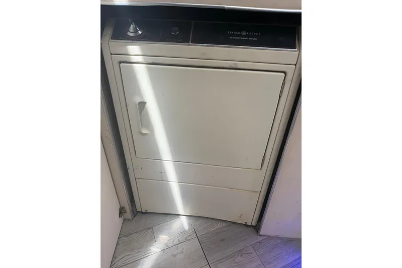 Slide: The Image of General Electric dryer inside 1989 Trojan International 12 Meter Motor Yacht. - 34