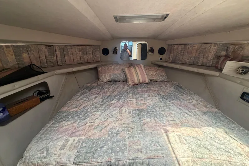 Slide: The Image of Cozy cabin interior of 1989 Trojan International 12 Meter Motor Yacht with patterned bedding. - 20