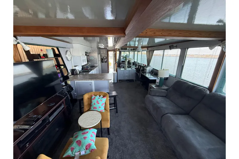 Slide: The Image of Interior of 1997 Fun Country 56 houseboat with cozy seating and modern kitchen. - 24
