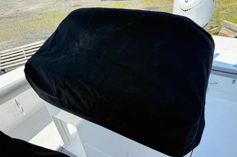 Slide: The Image of Covered console on 2026 Everglades 253 Center Console boat, outdoor setting. - 12