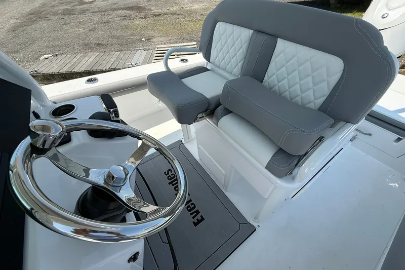 Slide: The Image of Luxury seating and steering wheel of 2026 Everglades 253 Center Console boat. - 20