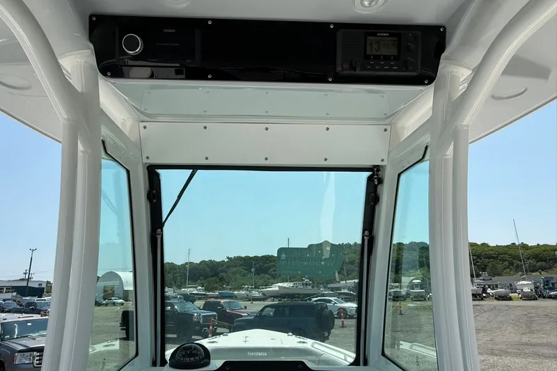 Slide: The Image of Interior view of 2026 Everglades 253 Center Console boat with navigation equipment. - 22