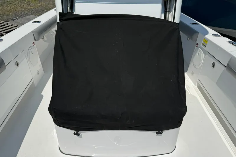 Slide: The Image of 2026 Everglades 253 Center Console boat with black console cover. - 10