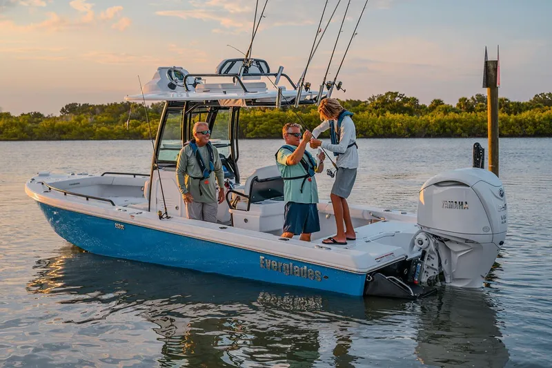 Slide: The Image of Manufacturer Provided Image: 2025 Everglades 253 Center Console boat with people fishing on calm water. - 3