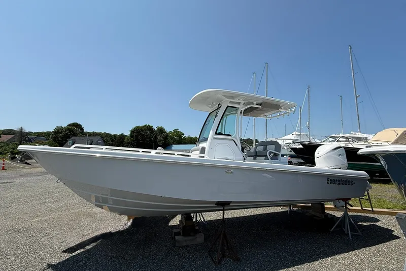 The Image of 2026 Everglades 253 Center Console boat on display in a marina setting. - 0