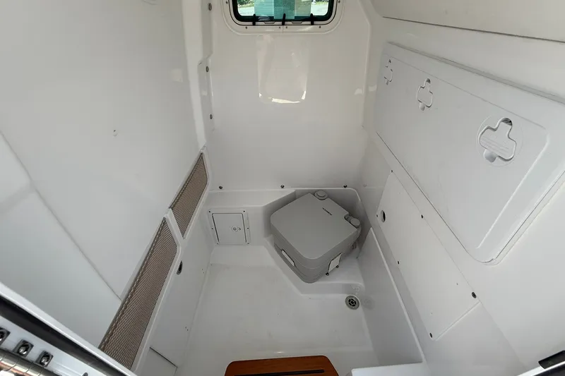 Slide: The Image of Interior of 2026 Everglades 253 Center Console boat with compact toilet. - 30