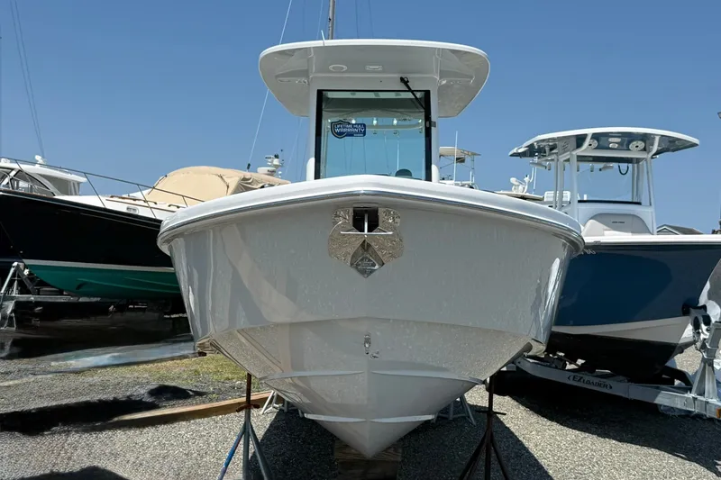 Slide: The Image of 2026 Everglades 253 Center Console boat displayed in a marina setting. - 4