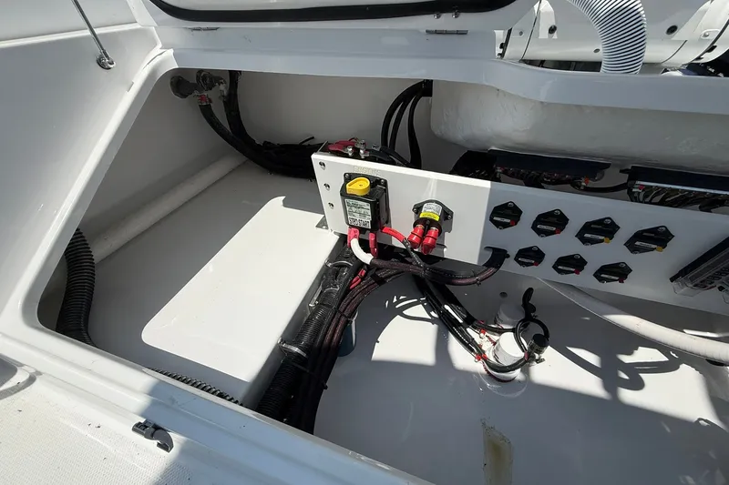 Slide: The Image of Electrical compartment of 2026 Everglades 253 Center Console boat, showcasing wiring and components. - 17