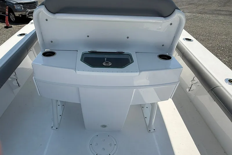 Slide: The Image of The image shows the cockpit of a 2026 Everglades 253 Center Console boat with cup holders and storage. - 18