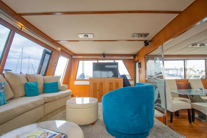 Slide: The Image of Luxurious interior of 1990 Kha Shing Flush Deck Motor Yacht with plush seating and modern decor. - 13