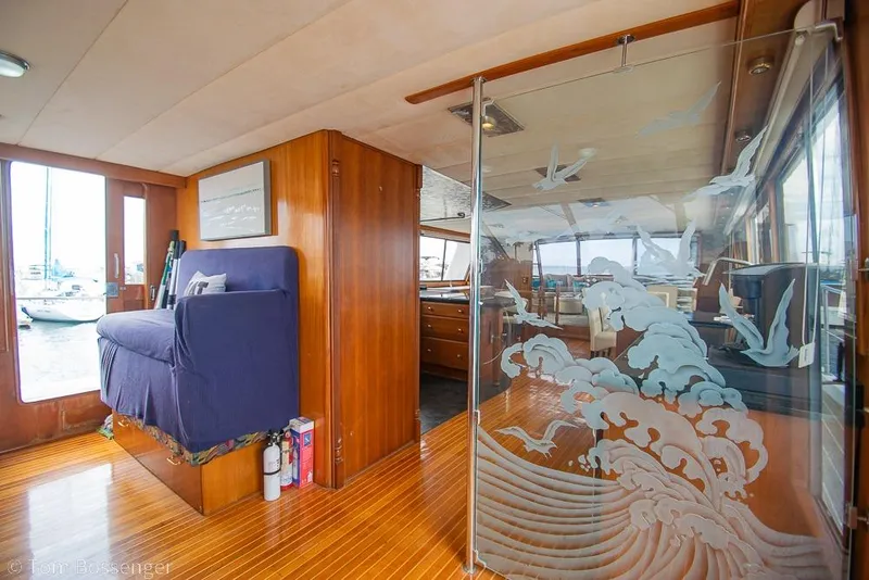 Slide: The Image of Interior of 1990 Kha Shing Flush Deck Motor Yacht with etched glass and wooden flooring. - 35