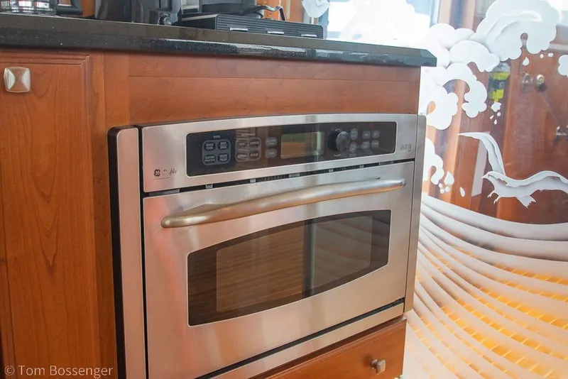 Slide: The Image of Stainless steel oven in a 1990 Kha Shing Flush Deck Motor Yacht kitchen. - 25