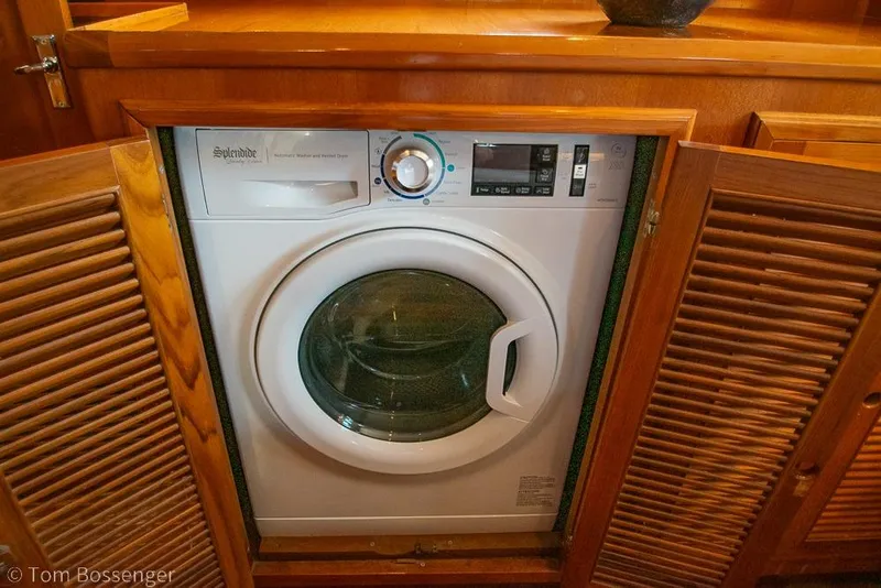 Slide: The Image of Built-in washer-dryer on 1990 Kha Shing Flush Deck Motor Yacht, wooden cabinet. - 24