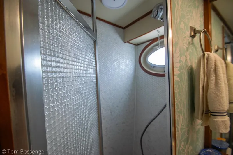 Slide: The Image of Shower area in 1990 Kha Shing Flush Deck Motor Yacht with textured glass door. - 23