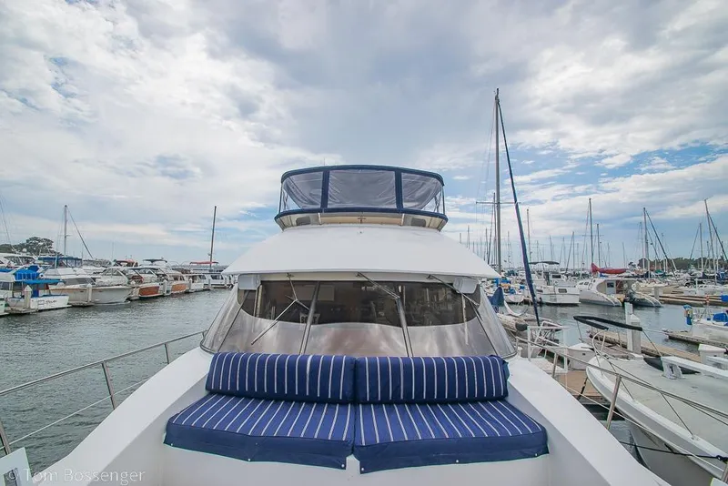 Slide: The Image of 1990 Kha Shing Flush Deck Motor Yacht docked at marina under cloudy sky. - 59
